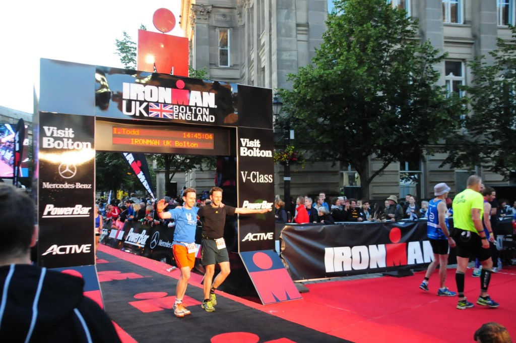 Andrew and Iain Todd crossing a race finish line